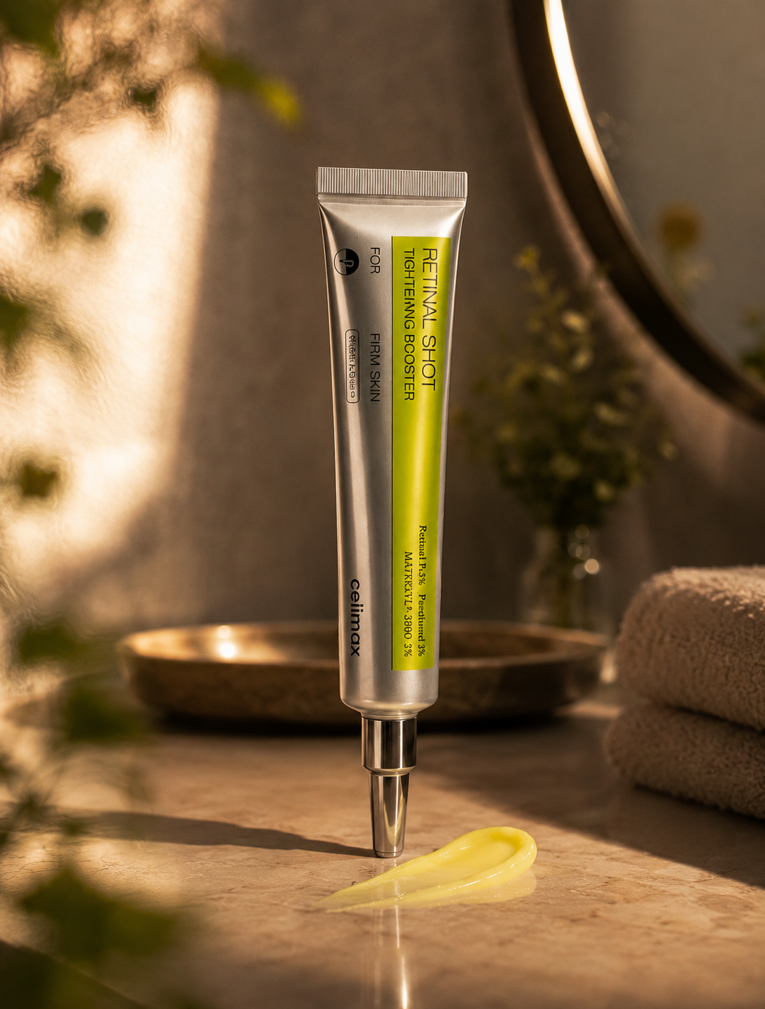 Tubo do sérum Celimax The Vita A Retinal Shot Tightening Booster em ambiente de ritual de skincare